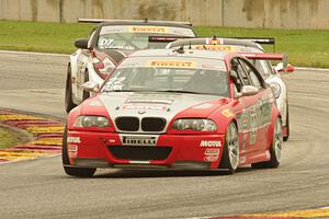 Larry Funk's BMW M3, Buz McCall's Porsche Cayman S and Brian Kleeman's Nissan 370Z