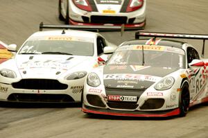 Buz McCall's Porsche Cayman S, Jorge De La Torre's Aston Martin Vantage GT4 and Brian Kleeman's Nissan 370Z