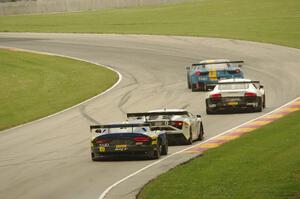 Four cars in the GT class battle into turn 13.