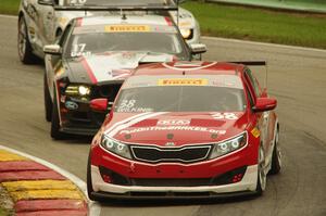 Mark Wilkins' Kia Optima, Alec Udell's Ford Mustang Boss 302S and Andy Lee's Chevy Camaro