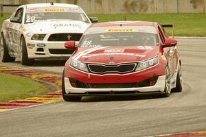 Mark Wilkins' Kia Optima and Dean Martin's Ford Mustang Boss 302S