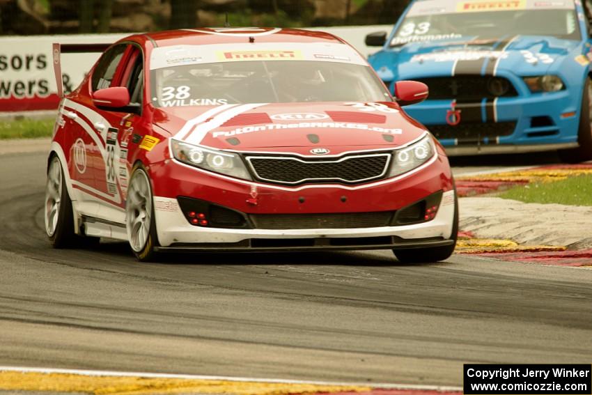 Mark Wilkins' Kia Optima and Tony Buffomante's Ford Mustang Boss 302S