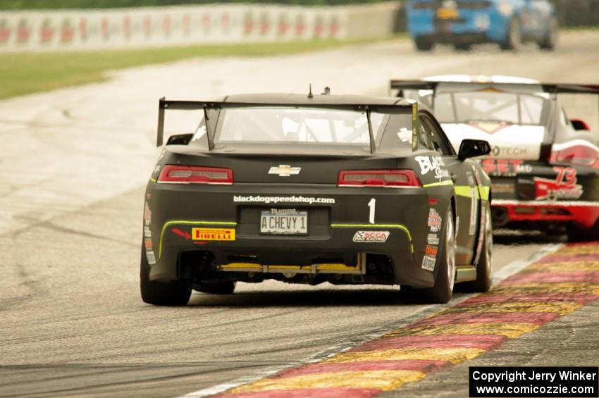 Lawson Aschenbach's Chevy Camaro chases Jack Baldwin's Porsche Cayman S