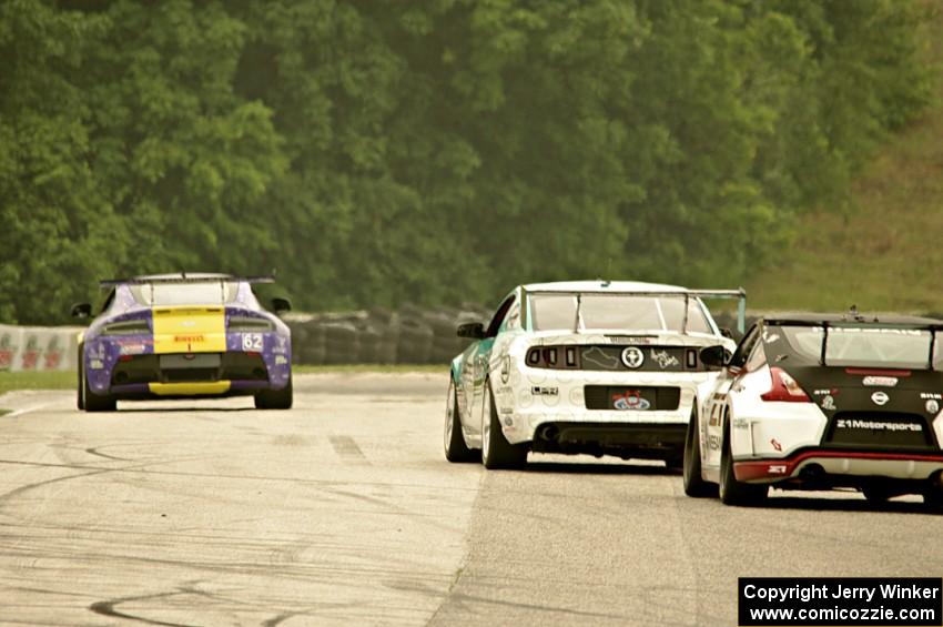 Mark Klenin's Aston Martin Vantage GT4 ahead of Erik Davis' Ford Mustang Boss 302S and Brian Kleeman's Nissan 370Z