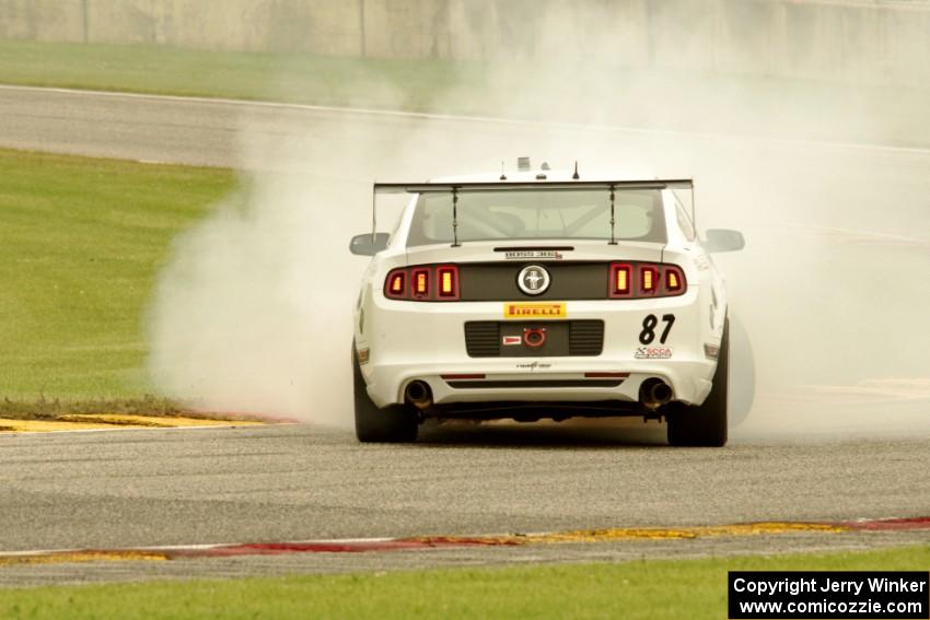 Chris Outzen's Ford Mustang Boss 302S comes to a stop after losing the engine on the first lap.