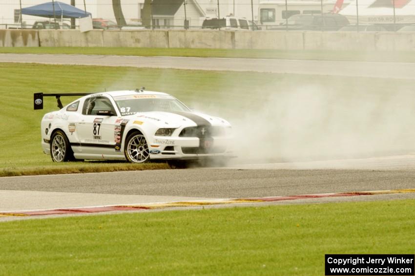 Chris Outzen's Ford Mustang Boss 302S comes to a stop after losing the engine on the first lap.