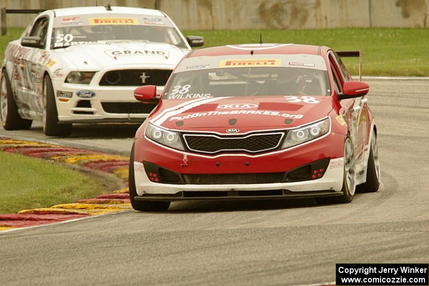 Mark Wilkins' Kia Optima and Dean Martin's Ford Mustang Boss 302S