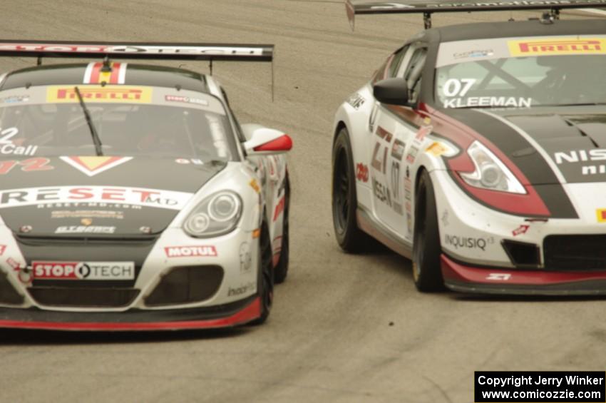 Buz McCall's Porsche Cayman S gets the inside line on Brian Kleeman's Nissan 370Z