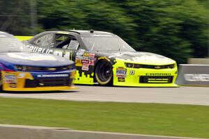 Justin Marks' Chevy Camaro passes by Chase Elliott's Chevy Camaro