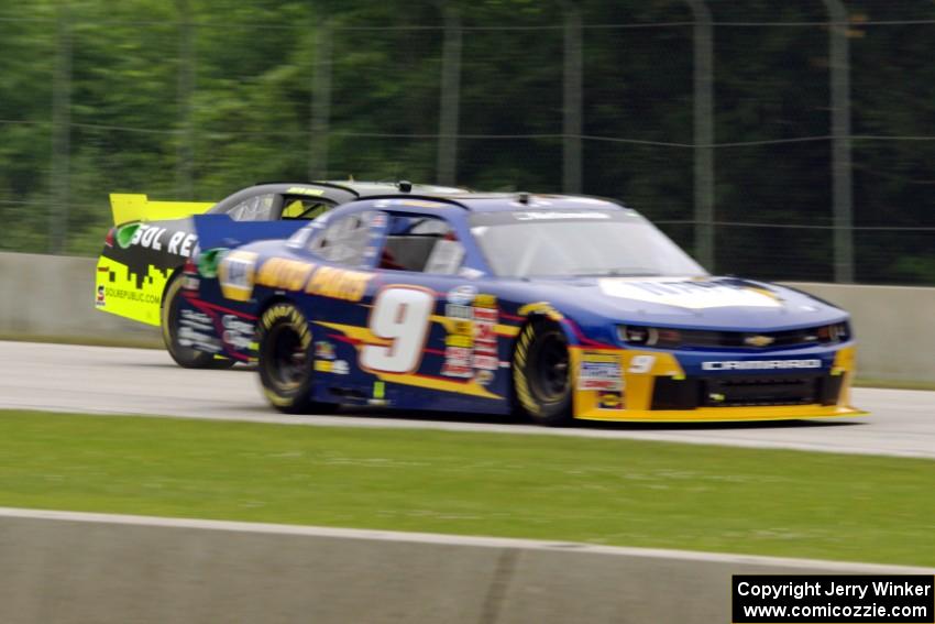 Justin Marks' Chevy Camaro passes by Chase Elliott's Chevy Camaro