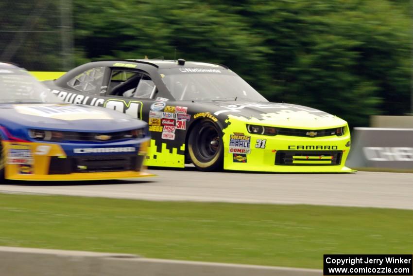 Justin Marks' Chevy Camaro passes by Chase Elliott's Chevy Camaro