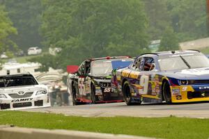 Chase Elliott's Chevy Camaro, Andy Lally's Chevy Camaro and Mike Bliss' Toyota Camry