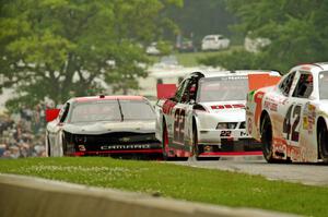 Dylan Kwasniewski's Chevy Camaro, Alex Tagliani's Dodge Challenger and Ty Dillon's Chevy Camaro