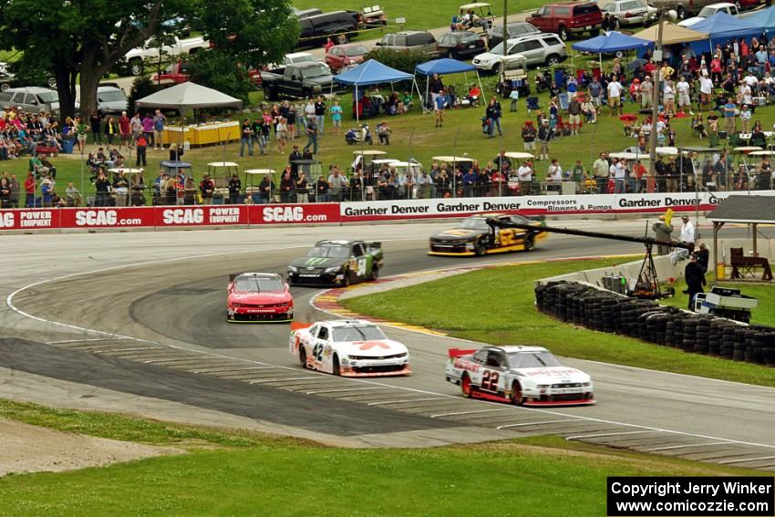 The front of the field at turn 5 on the pace lap.