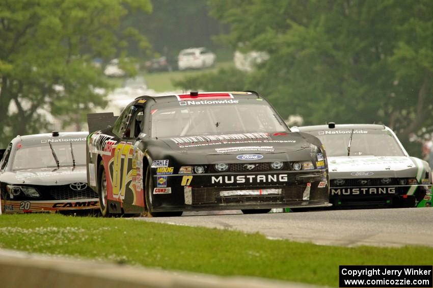 Stanton Barrett's Ford Mustang, Dakoda Armstrong's Ford Mustang and Kenny Habul's Toyota Camry