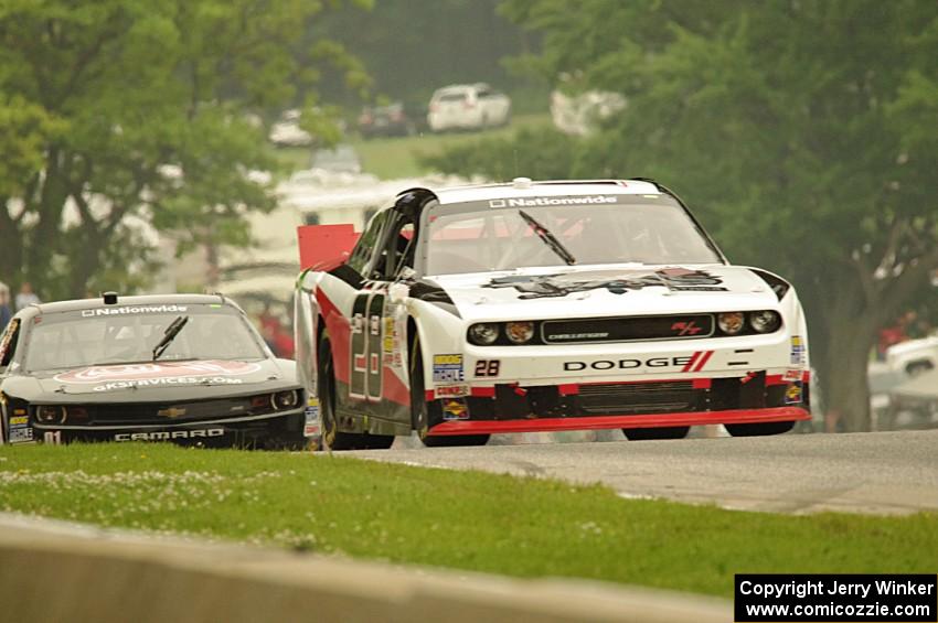 J.J. Yeley's Dodge Challenger and Landon Cassill's Chevy Camaro