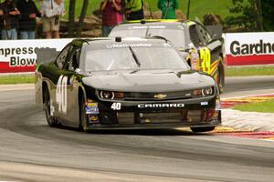 Matt DiBenedetto's Chevy Camaro and Ryan Sieg's Chevy Camaro