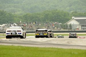 Trevor Bayne's Ford Mustang brings up the rear of a pack at turn 7.