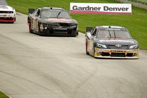 Kenny Habul's Toyota Camry and Landon Cassill's Chevy Camaro