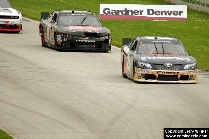 Kenny Habul's Toyota Camry and Landon Cassill's Chevy Camaro