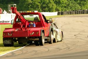 Justin Marks' Chevy Camaro is pushed off the track.