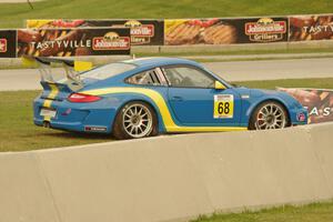 Wayne Ducote's Porsche GT3 Cup pulls off course just after turn 8.