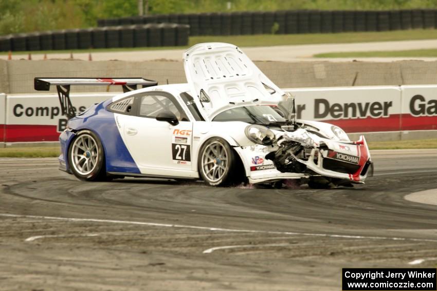 Javier Quiros' Porsche GT3 Cup spins and stalls at turn 8 on the first lap.