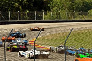 Panoz Élan DP-02s battle into turn one after the drop of the green.