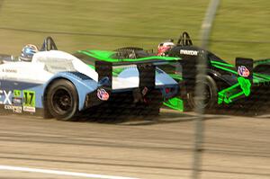 Anthony Downs nips Madison Snow for the apex, both in Panoz Élan DP-02s