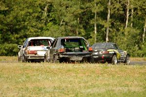 Team Party Cat Mazda Miata ahead of The Most Interesting Chumps In The World BMW 325i and Mayhem Racing Honda Civic