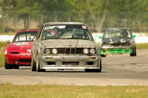 Brainerd Bombers Racing BMW 328, MiElan Mazda Miata and 365Racing Tuna No Crust BMW 325i