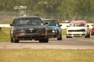 JSK Racing Nissan Maxima, Nikki and Paris Racing BMW 325e and Tubby Butterman Racing BMW 325i