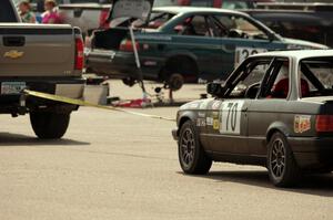 Speed Doctors BMW 325is comes back to the paddock on the end of a tow rope.