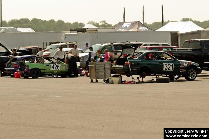 Danger Zone Racing Honda CRX In The Red BMW 325is in the paddock early on during Saturday's race.