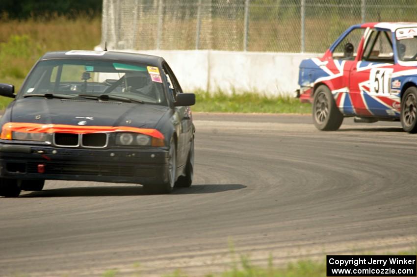 North Loop Motorsports 1 BMW 325 goes though the carousel as the British American Racing BMW 325is pits.