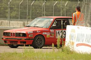 E30 Bombers BMW 325i awaits re-entry onto the track