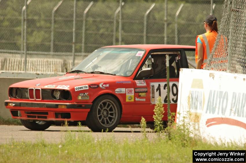 E30 Bombers BMW 325i awaits re-entry onto the track