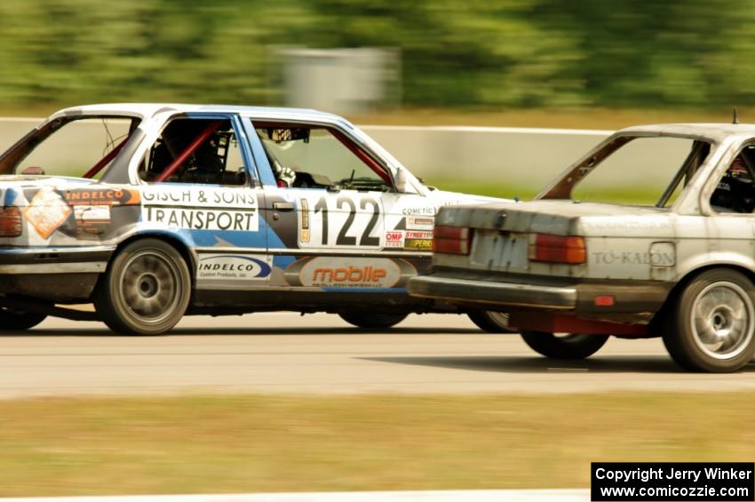 The Most Interesting Chumps In The World BMW 325i and Brainerd Bombers Racing BMW 328 go side-by-side into turn 2.