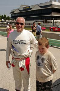 A young fan poses with Peter Cunningham on the grid walk.