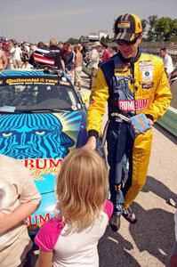 A young fan gets an autograph from Matt Plumb.