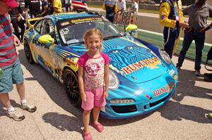 A young fan poses with the Matt Plumb / Nick Longhi Porsche 997.