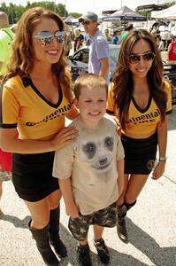 Pirelli girls with a young fan during the grid walk.