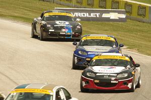 Tyler McQuarrie / Marc Miller and Stevan McAleer / Chad McCumbee Mazda MX-5s, and Cody Ellsworth / Corey Lewis Porsche Cayman