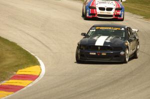 Ian James / Billy Johnson Ford Mustang Boss 302R and Trent Hindman / John Edwards BMW M3