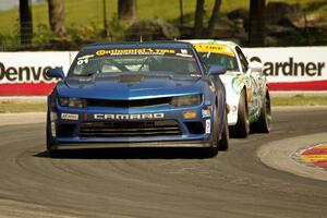 Eric Curran / Lawson Aschenbach Chevy Camaro Z/28.R and Britt Casey, Jr. / Mark White Mazda MX-5