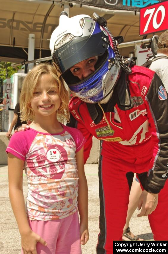 A young fan poses with Katherine Legge on the grid walk.