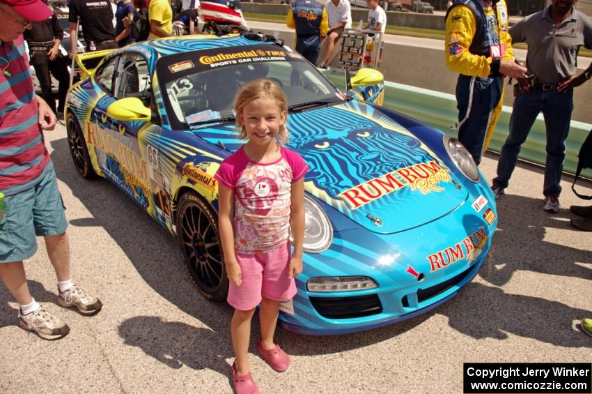 A young fan poses with the Matt Plumb / Nick Longhi Porsche 997.