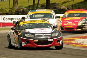 Tyler McQuarrie / Marc Miller Mazda MX-5 and Terry Borcheller / Mike LaMarra BMW 128i