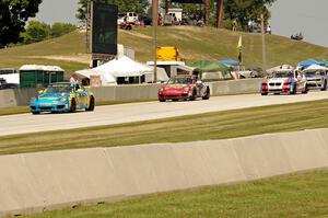 Matt Plumb / Nick Longhi Porsche 997 leads the field into turn 8.