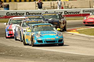 Matt Plumb / Nick Longhi Porsche 997 leads the field through turn 8.